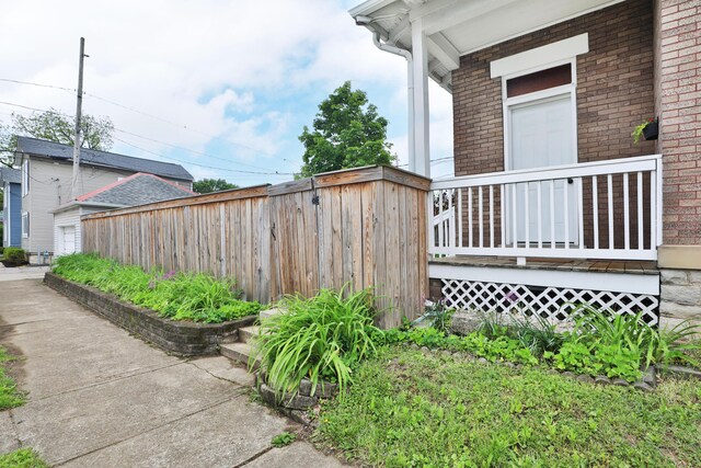 459 E Whittier St, Columbus, OH 43206 - view of side of home featuring brick siding and fence