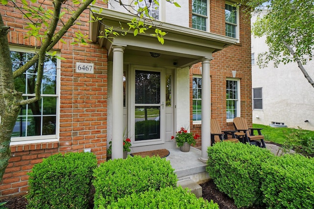 6467 Spring Run Dr, Westerville, OH 43082 - entrance to property with a porch, brick siding, and stucco siding