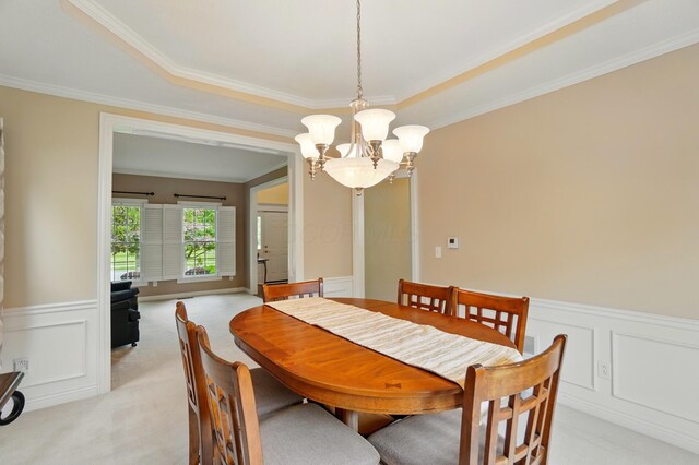 6467 Spring Run Dr, Westerville, OH 43082 - dining room featuring a chandelier, light carpet, ornamental molding, wainscoting, and a decorative wall