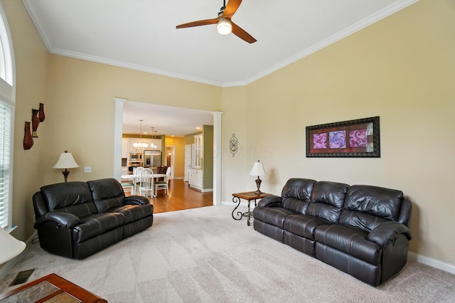 6467 Spring Run Dr, Westerville, OH 43082 - carpeted living area featuring ornamental molding, ceiling fan, baseboards, and decorative columns