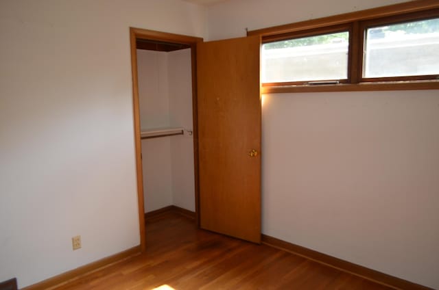 494 Park Overlook Dr, Worthington, OH 43085 - unfurnished bedroom with wood finished floors, a closet, and baseboards