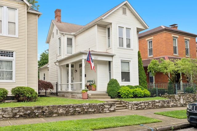 1057 Harrison Ave, Columbus, OH 43201 - view of front of home featuring covered porch
