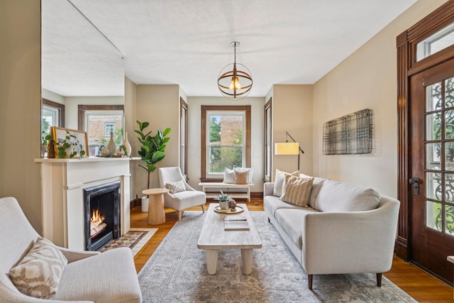 1057 Harrison Ave, Columbus, OH 43201 - living room featuring wood finished floors and a fireplace with flush hearth