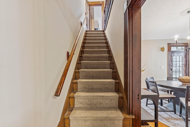 1057 Harrison Ave, Columbus, OH 43201 - staircase with a chandelier