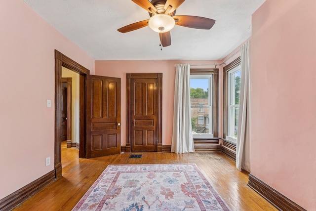 1057 Harrison Ave, Columbus, OH 43201 - foyer featuring light wood-style flooring and a ceiling fan