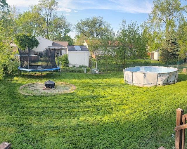 view of yard with a trampoline