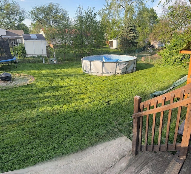 view of yard featuring a trampoline