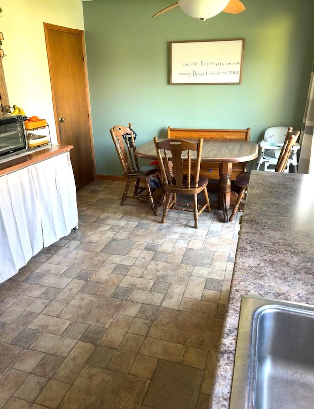 dining area featuring a ceiling fan
