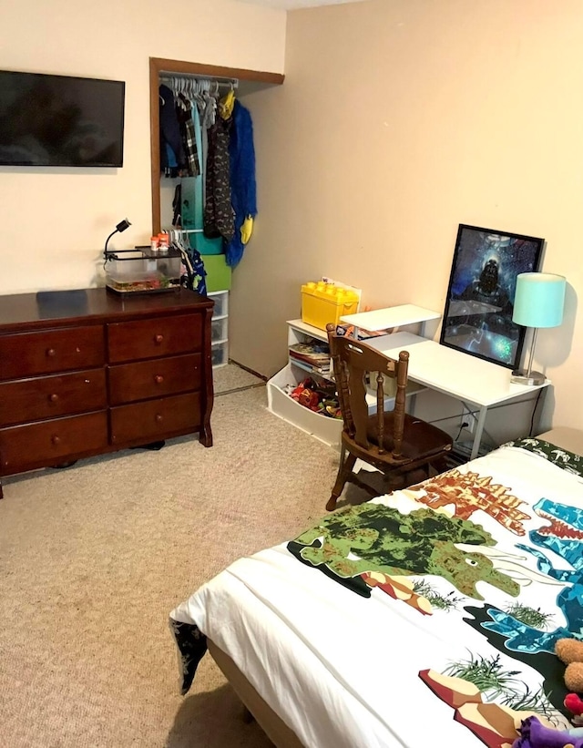 carpeted bedroom featuring a closet