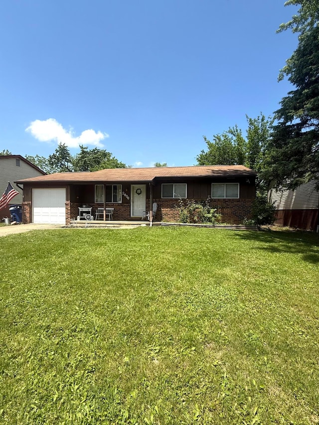 2836 Palisades Ave, Columbus, OH 43207 - single story home with a front yard, an attached garage, brick siding, and board and batten siding