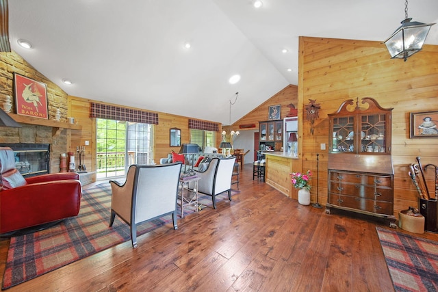 7326 State Route 19 Unit 3, Lots 1-2, Mount Gilead, OH 43338 - living room featuring wooden walls, hardwood / wood-style floors, a fireplace, and high vaulted ceiling