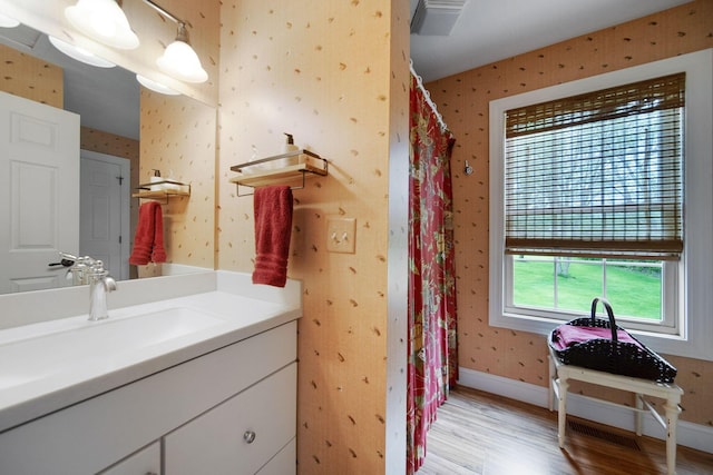 7326 State Route 19 Unit 3, Lots 1-2, Mount Gilead, OH 43338 - bathroom featuring wallpapered walls, wood finished floors, vanity, baseboards, and curtained shower