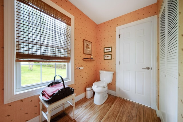 7326 State Route 19 Unit 3, Lots 1-2, Mount Gilead, OH 43338 - half bathroom with wood finished floors, toilet, baseboards, and wallpapered walls
