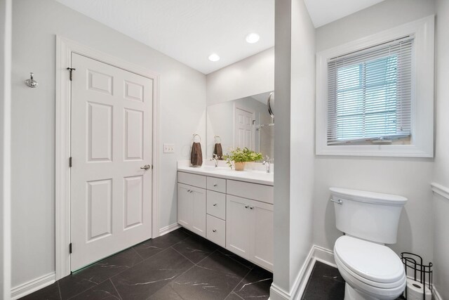 7326 State Route 19 Unit 3, Lots 1-2, Mount Gilead, OH 43338 - full bathroom featuring baseboards, marble look tile flooring, double vanity, toilet, and recessed lighting