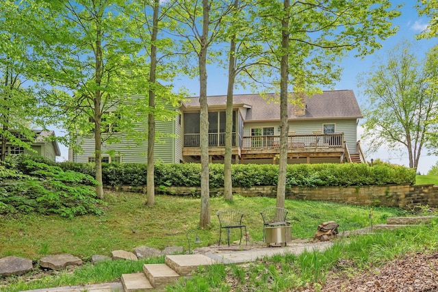7326 State Route 19 Unit 3, Lots 1-2, Mount Gilead, OH 43338 - rear view of property featuring a sunroom, a deck, a shingled roof, and a lawn