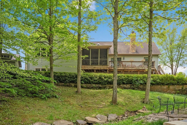 7326 State Route 19 Unit 3, Lots 1-2, Mount Gilead, OH 43338 - rear view of property featuring a sunroom, a chimney, a deck, a yard, and a shingled roof
