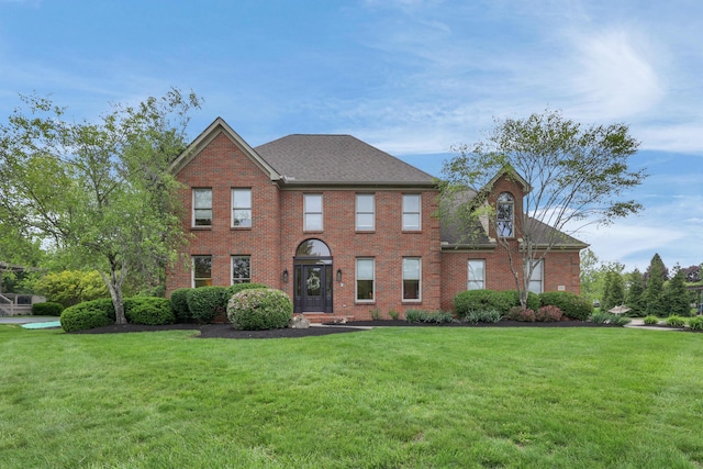 7832 Windsor Ave NW, Canal Winchester, OH 43110 - view of front of property with a front lawn, brick siding, and a shingled roof