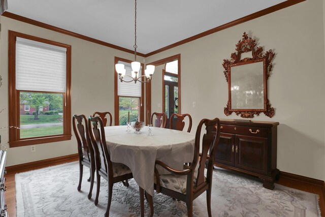 7832 Windsor Ave NW, Canal Winchester, OH 43110 - dining room featuring a chandelier, light wood finished floors, baseboards, and ornamental molding