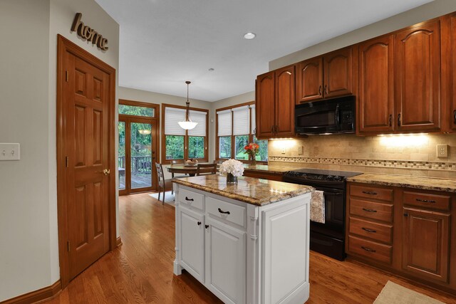 7832 Windsor Ave NW, Canal Winchester, OH 43110 - kitchen with black appliances, backsplash, light wood-type flooring, and recessed lighting