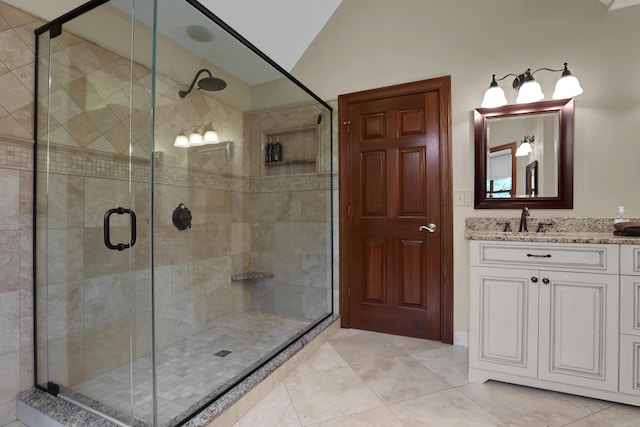 7832 Windsor Ave NW, Canal Winchester, OH 43110 - bathroom with vaulted ceiling, a stall shower, and vanity