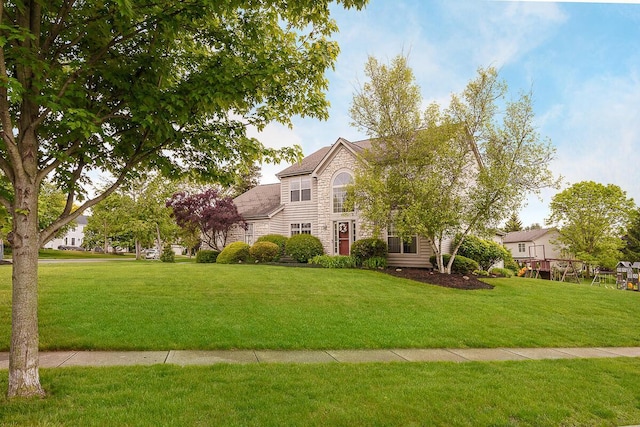 view of front of property with stone siding and a front lawn