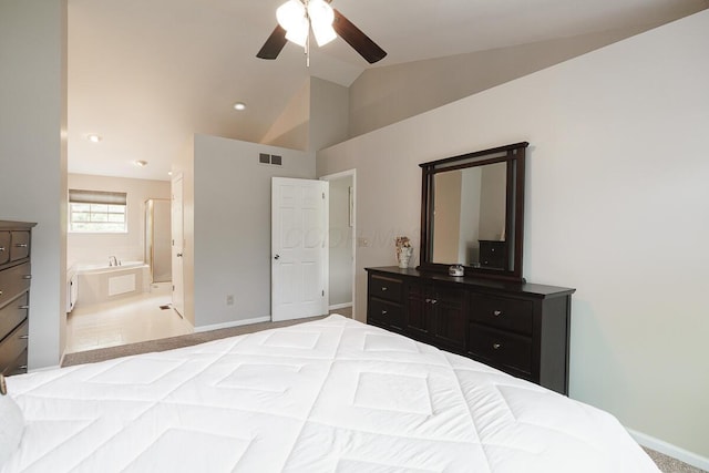 bedroom featuring vaulted ceiling, connected bathroom, baseboards, and a ceiling fan