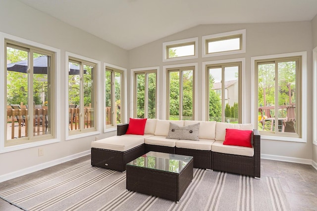 sunroom / solarium with vaulted ceiling and baseboards