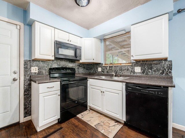 5030 Holbrook Dr, Columbus, OH 43232 - kitchen featuring black appliances, a sink, dark countertops, and backsplash