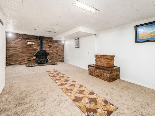 5030 Holbrook Dr, Columbus, OH 43232 - finished below grade area with carpet, a wood stove, and baseboards