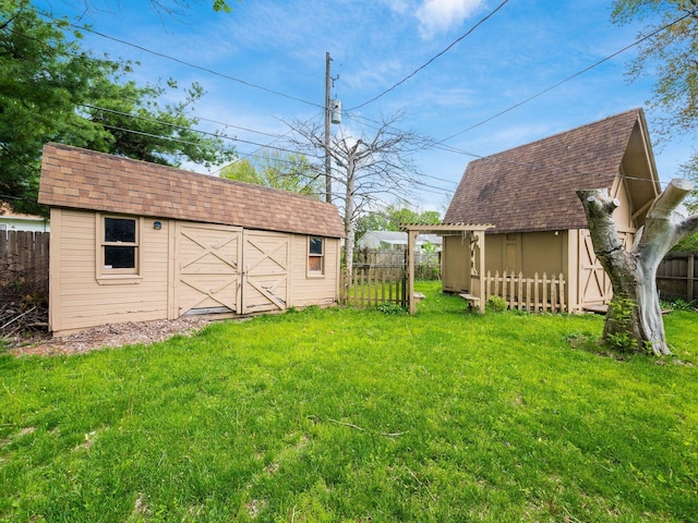 5030 Holbrook Dr, Columbus, OH 43232 - view of yard featuring a storage shed and an outbuilding