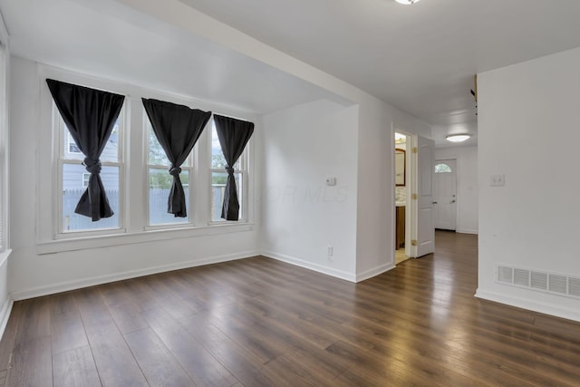 155 N Harris Ave, Columbus, OH 43204 - empty room with baseboards and dark wood-style flooring