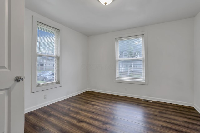 155 N Harris Ave, Columbus, OH 43204 - spare room with dark wood finished floors and baseboards