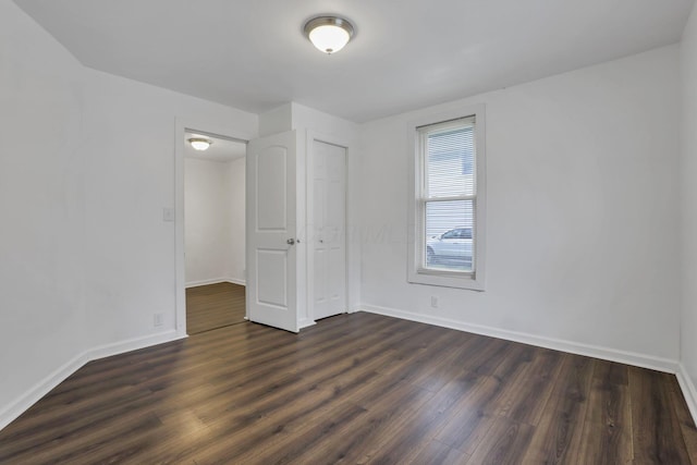 155 N Harris Ave, Columbus, OH 43204 - unfurnished room featuring baseboards and dark wood-style floors