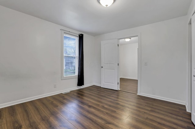 155 N Harris Ave, Columbus, OH 43204 - unfurnished bedroom with baseboards and wood finished floors