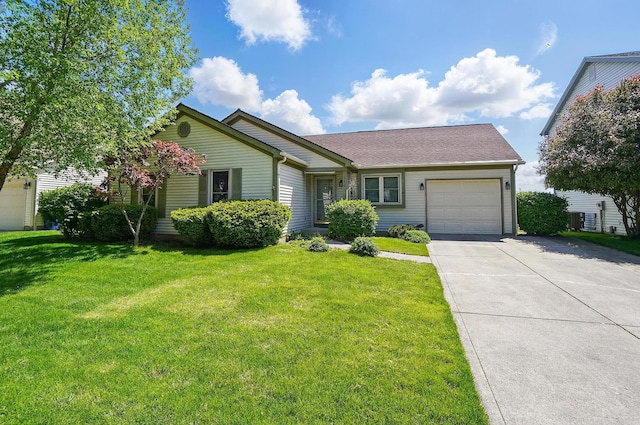 371 Federal Cir, Delaware, OH 43015 - ranch-style home featuring a garage, driveway, a front lawn, and roof with shingles