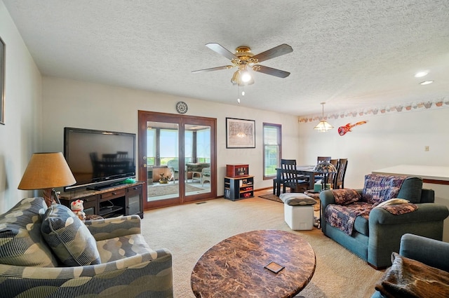 371 Federal Cir, Delaware, OH 43015 - living area with carpet, ceiling fan, and a textured ceiling