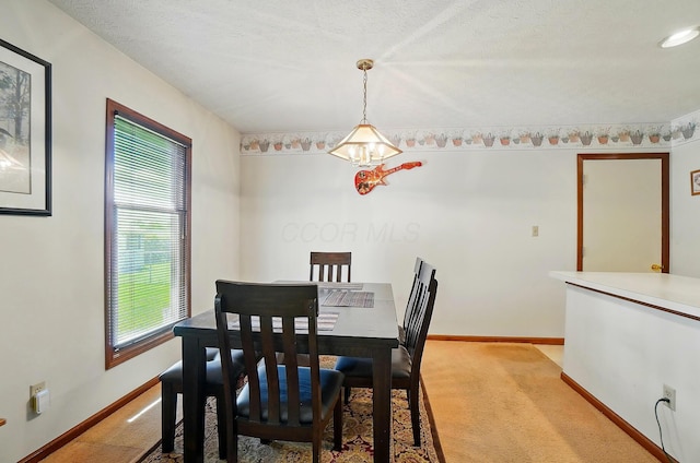 371 Federal Cir, Delaware, OH 43015 - dining space with carpet, a chandelier, and baseboards