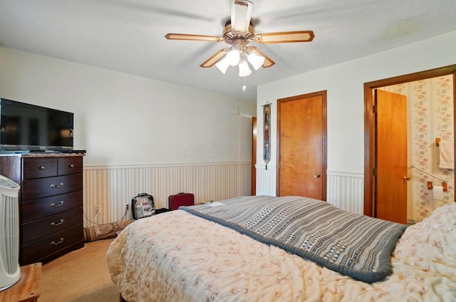 371 Federal Cir, Delaware, OH 43015 - bedroom featuring light carpet, a wainscoted wall, and a ceiling fan