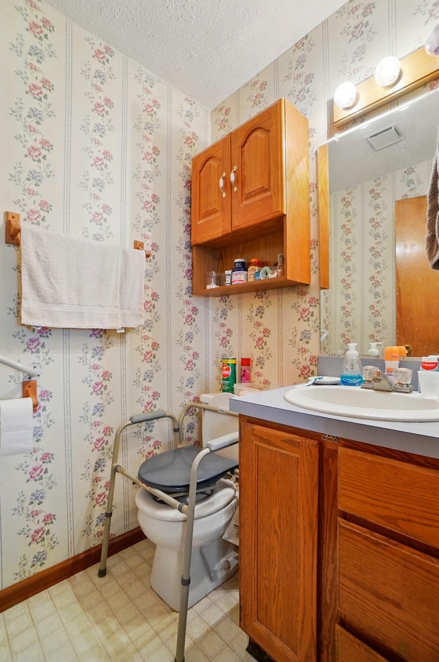 371 Federal Cir, Delaware, OH 43015 - bathroom with tile patterned floors, a textured ceiling, vanity, and toilet