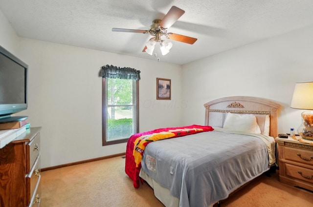 371 Federal Cir, Delaware, OH 43015 - bedroom with light colored carpet, baseboards, a textured ceiling, and ceiling fan