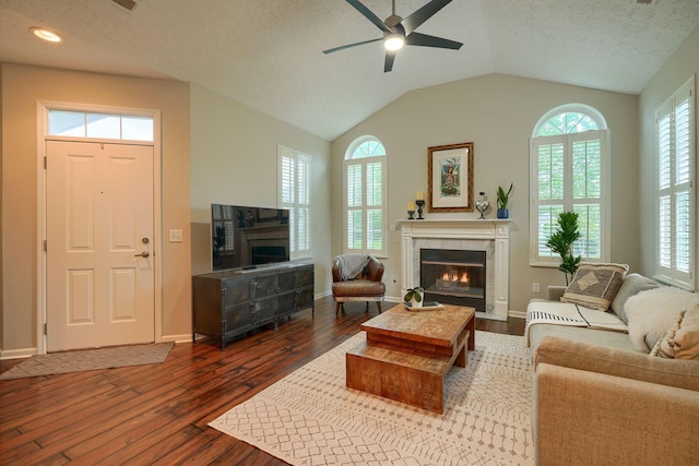 4115 Aumbrey Ct, New Albany, OH 43054 - living room with a tile fireplace, dark wood-type flooring, a ceiling fan, healthy amount of natural light, and a textured ceiling