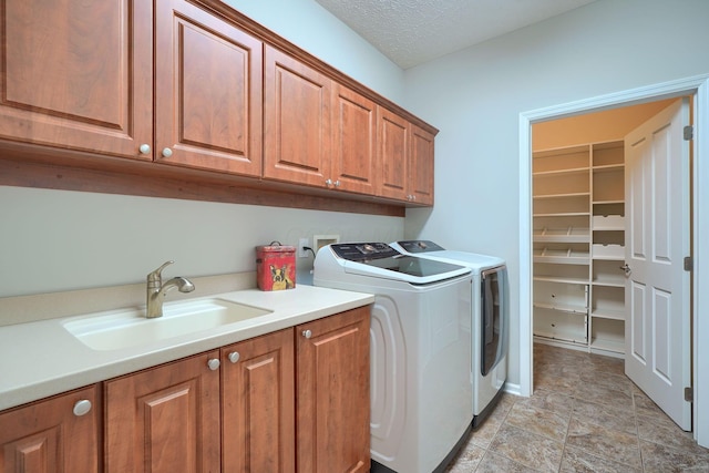 4115 Aumbrey Ct, New Albany, OH 43054 - clothes washing area with cabinet space, independent washer and dryer, a textured ceiling, and stone finish flooring