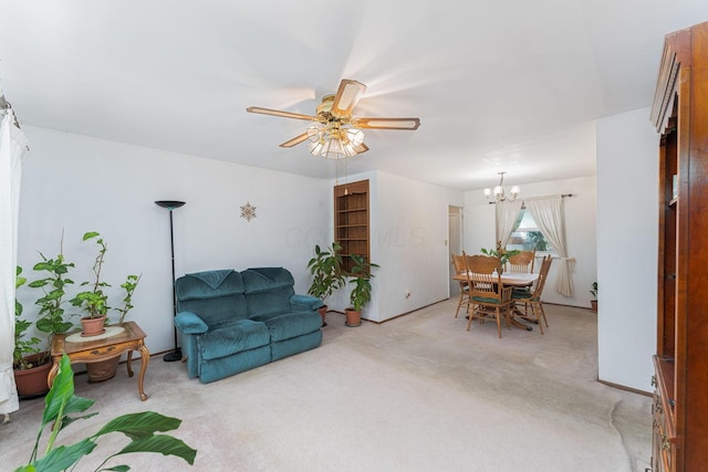 6241 Faircrest Rd, Columbus, OH 43229 - living room featuring a ceiling fan, a chandelier, and light colored carpet