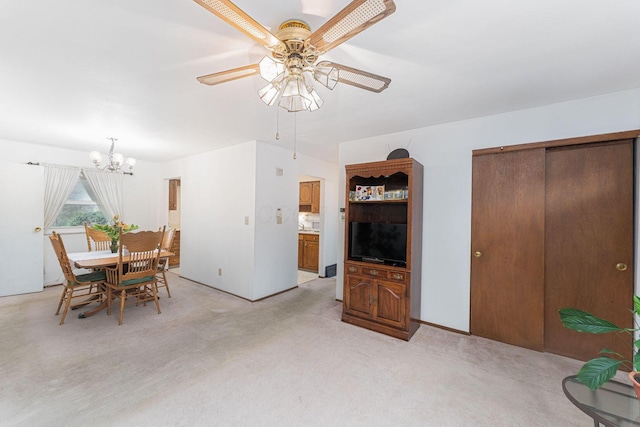 6241 Faircrest Rd, Columbus, OH 43229 - dining room featuring ceiling fan, a chandelier, and light colored carpet
