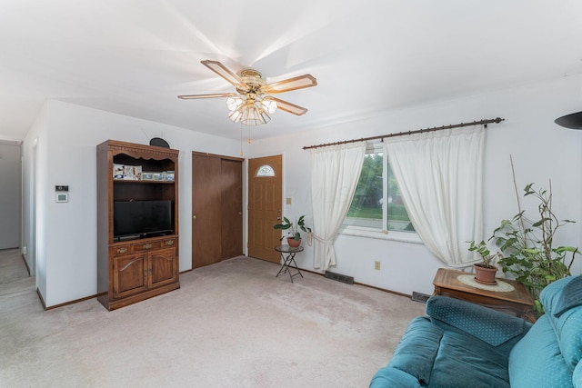 6241 Faircrest Rd, Columbus, OH 43229 - living room featuring ceiling fan, light carpet, and baseboards