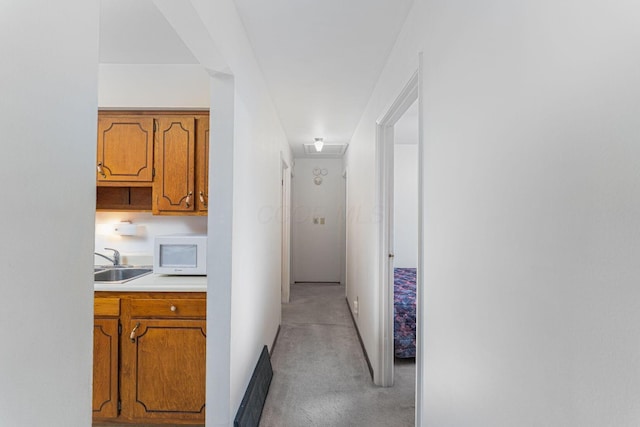 6241 Faircrest Rd, Columbus, OH 43229 - hall featuring a sink and light carpet