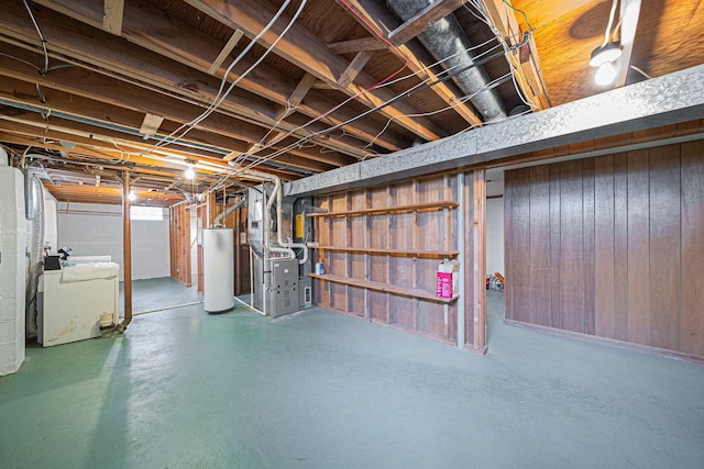 6241 Faircrest Rd, Columbus, OH 43229 - unfinished basement with water heater, heating unit, wood walls, and washer and clothes dryer