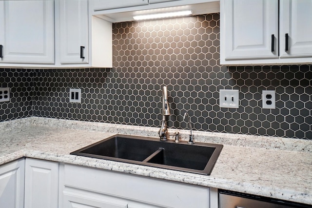 820 N Walnut St, Baltimore, OH 43105 - kitchen with white cabinets, a sink, decorative backsplash, and dishwasher