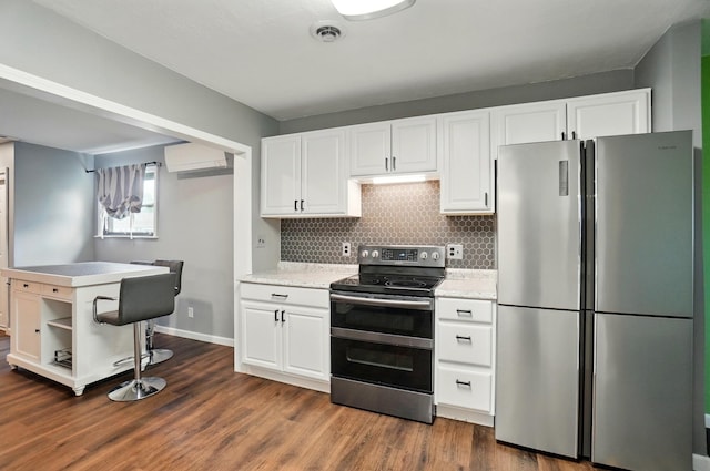 820 N Walnut St, Baltimore, OH 43105 - kitchen featuring appliances with stainless steel finishes, white cabinetry, open shelves, decorative backsplash, and dark wood finished floors