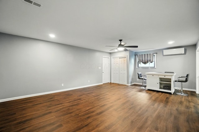 820 N Walnut St, Baltimore, OH 43105 - unfurnished bedroom with a wall mounted air conditioner, baseboards, dark wood finished floors, recessed lighting, and ceiling fan